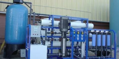 Industrial RO skid with dosing tanks, pumps, and cartridge filter housings